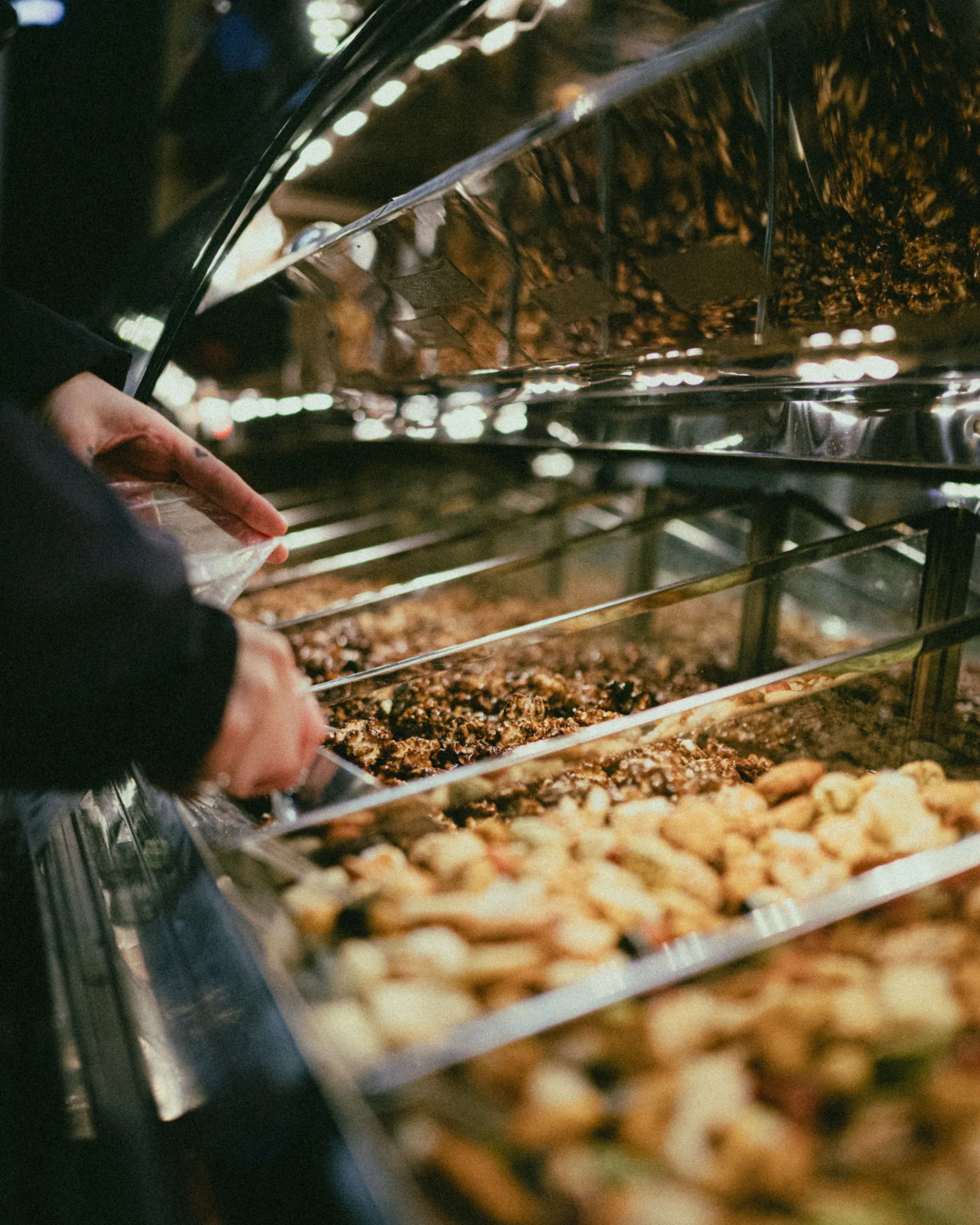 Representative customer selecting dried goods in a retail store